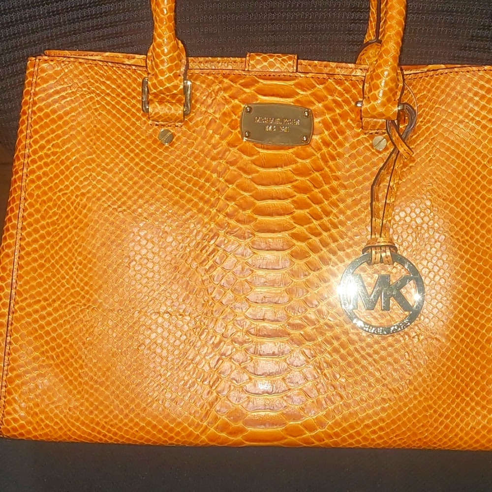 Brown or tan snake skin embossed Michael Kors handbag